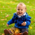 baby-with-fall-leaves-happy-image