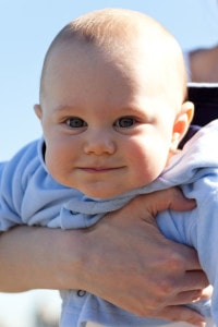 cute-smiling-baby-being-held-image